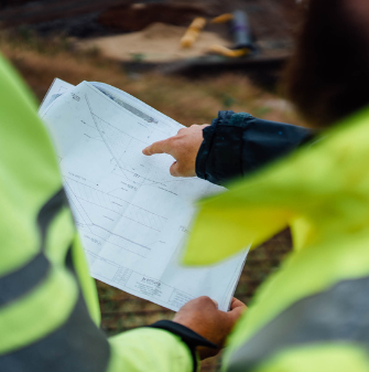 Two people looking at plans