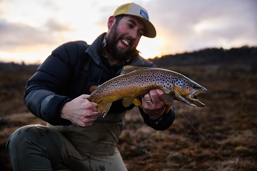 Fly fisherman with a trout caught at Little Pine Lagoon