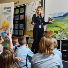 Education Coordinator Gina in a primary school class room with students discussing how Tasmania&#39;s water catchments work